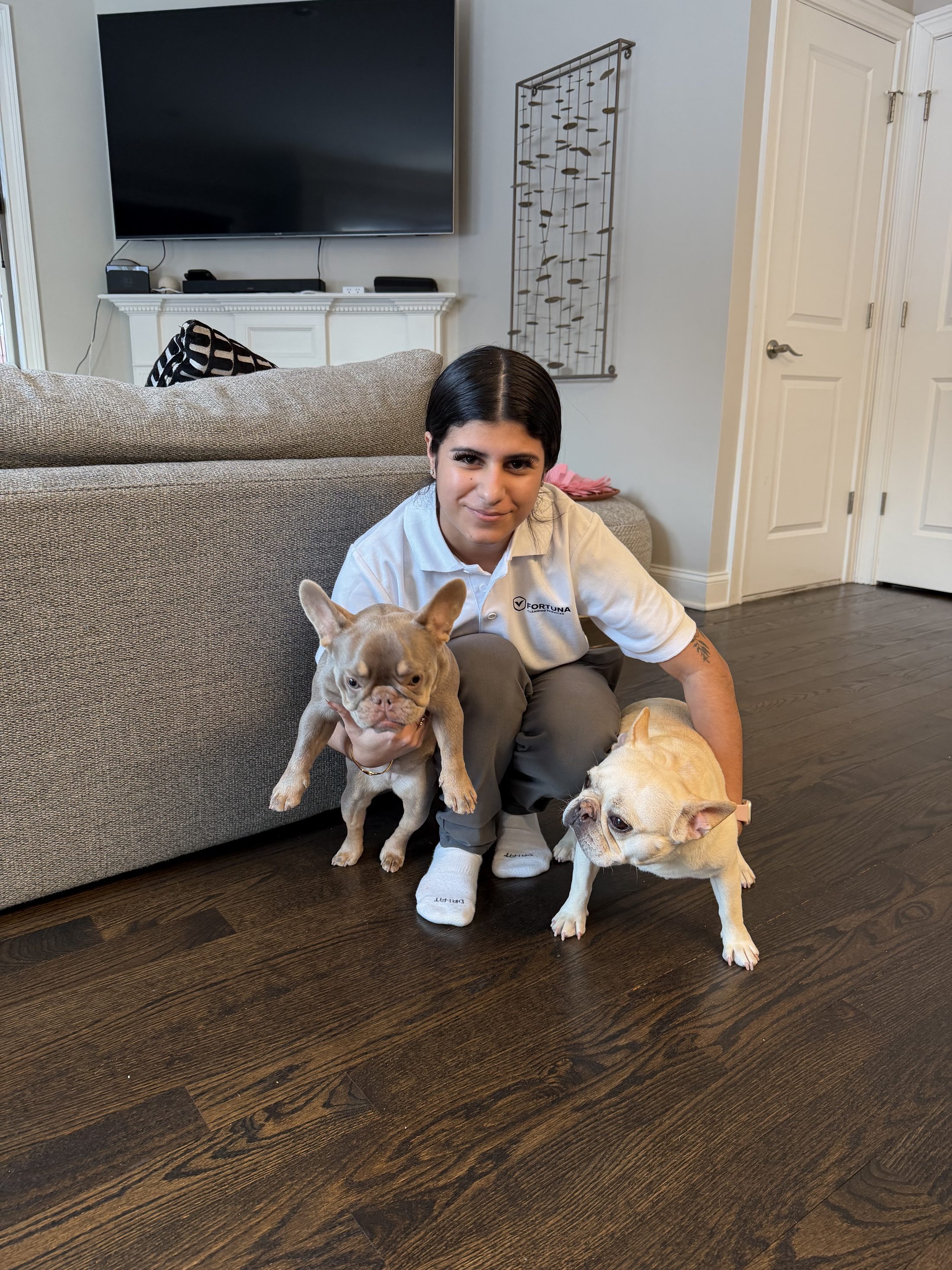 Alejandra with two dogs in a customer home